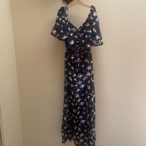 Micas. Small. Black with pink flowers.